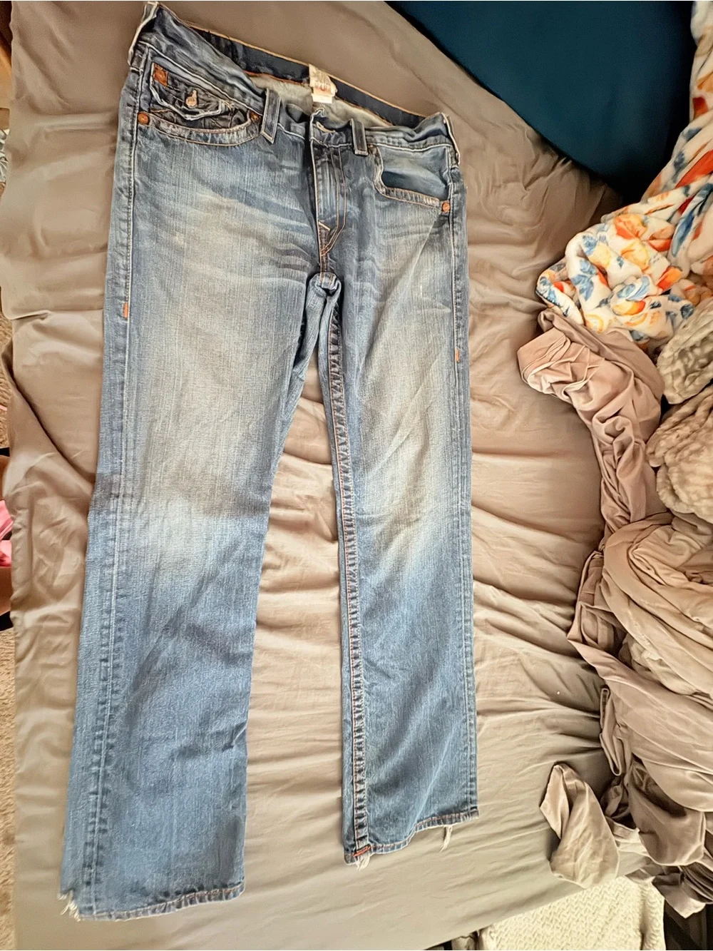 True Religion Men's Straight Jeans in Medium Blue with Distressed Hem